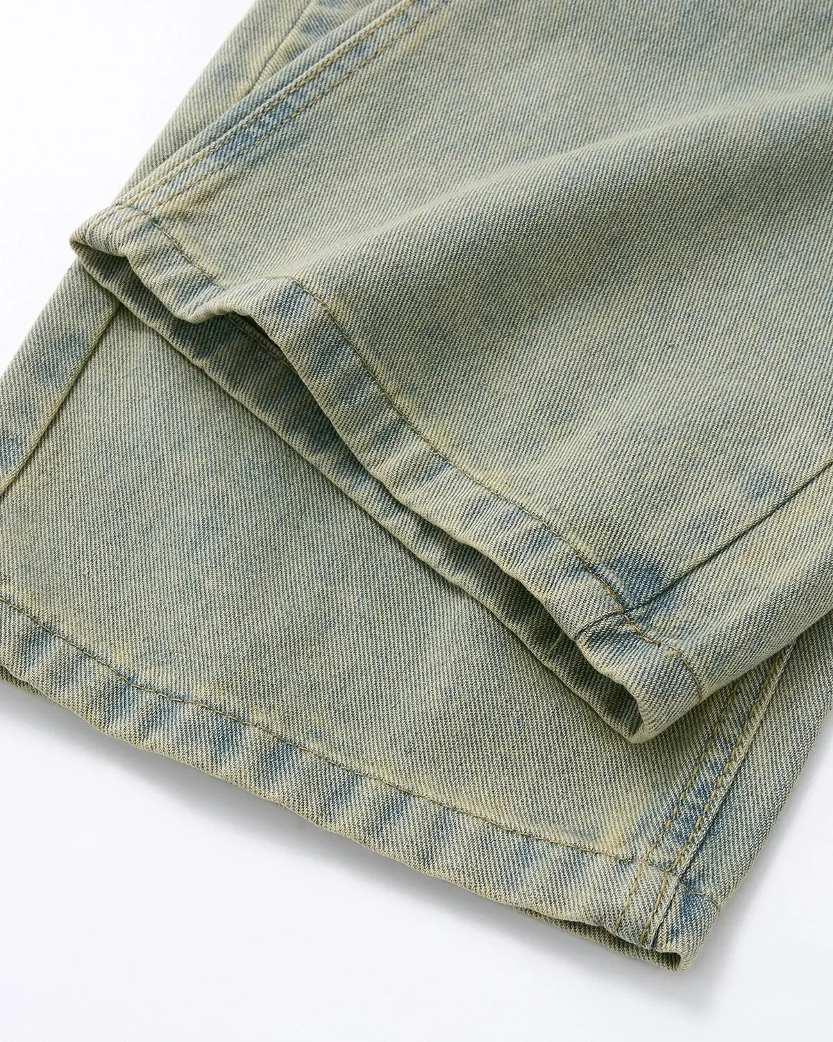 Vintage washed baggy jeans by INFLATION with distressed details and relaxed fit, displayed on a hanger against a plain background.
