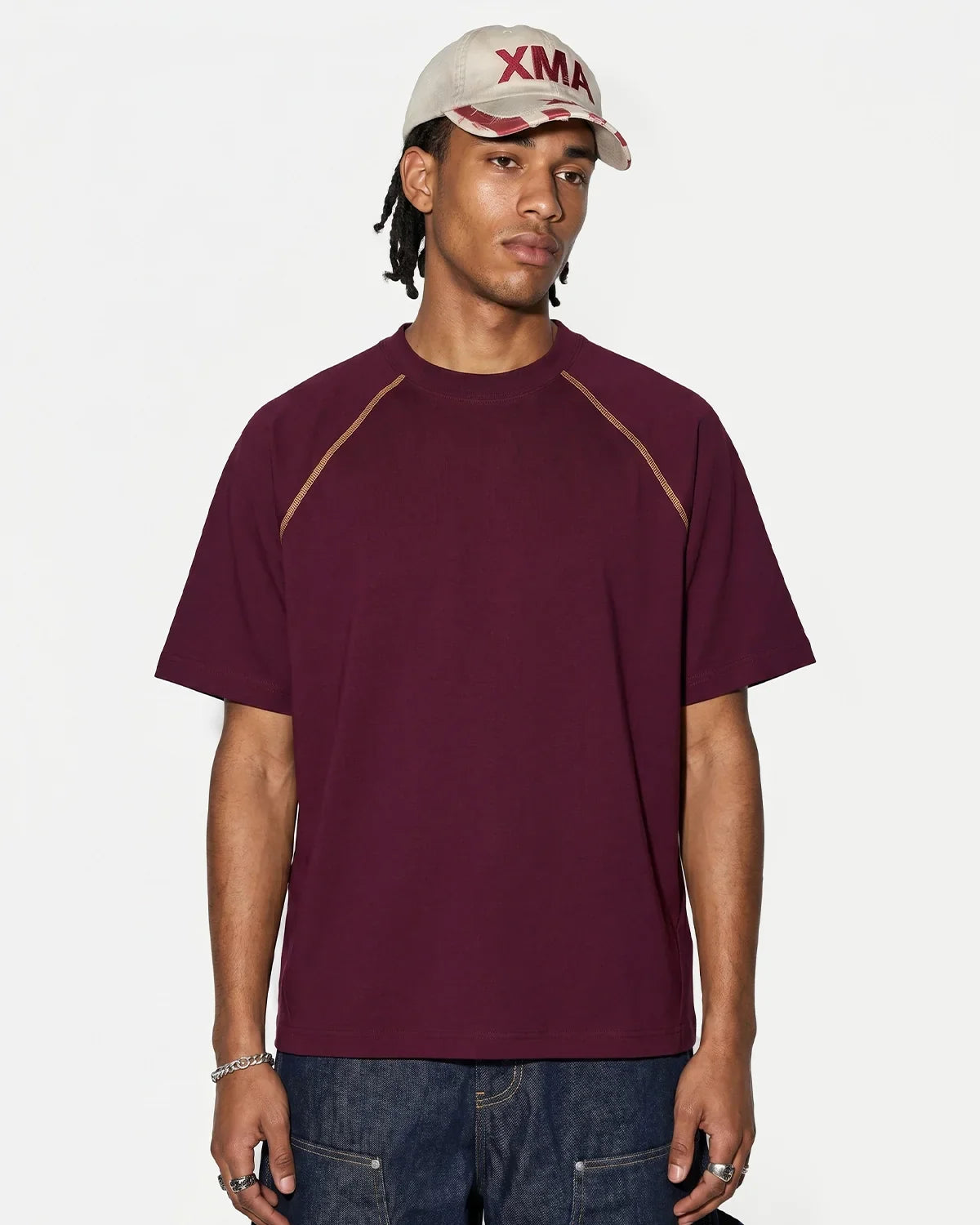 Inflation streetwear contrast stitching stretch T-shirt in black with colorful stitch accents and fitted style.