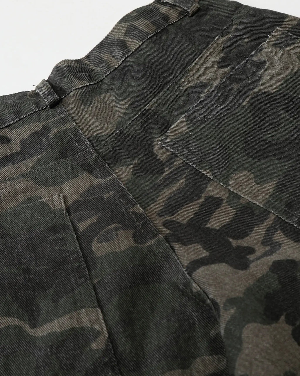 Inflation Streetwear camo cargo pants with multiple pockets, featuring a relaxed fit and military-inspired camouflage pattern.