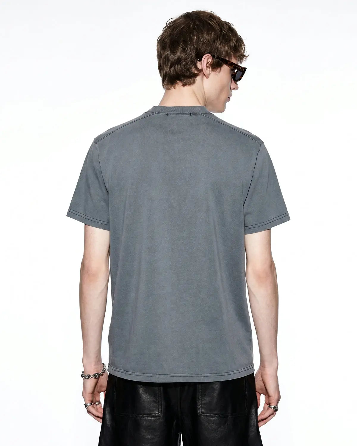 Inflation Streetwear distressed spray wash graphic T-shirt with bold printed design and faded, vintage-style fabric.