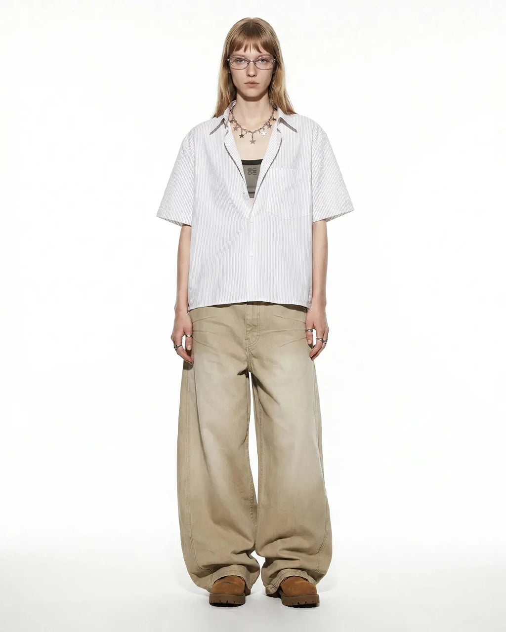 Inflation Streetwear boxy striped short-sleeve shirt with a relaxed fit and bold horizontal stripes in various colors.