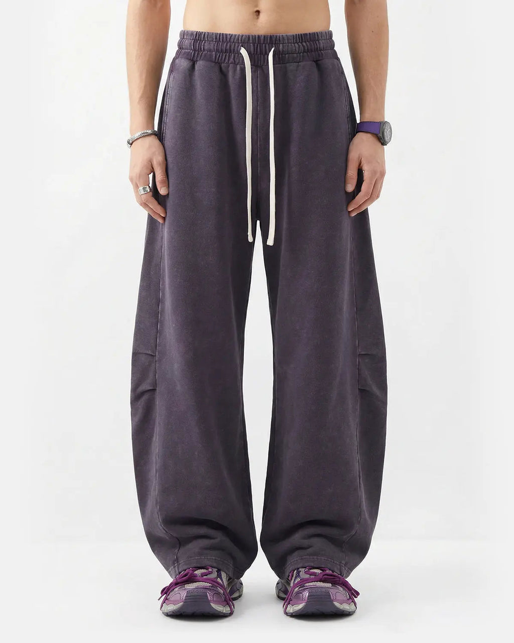 Distressed acid washed barrel sweatpants from Inflation Streetwear featuring a relaxed fit and worn-in style.