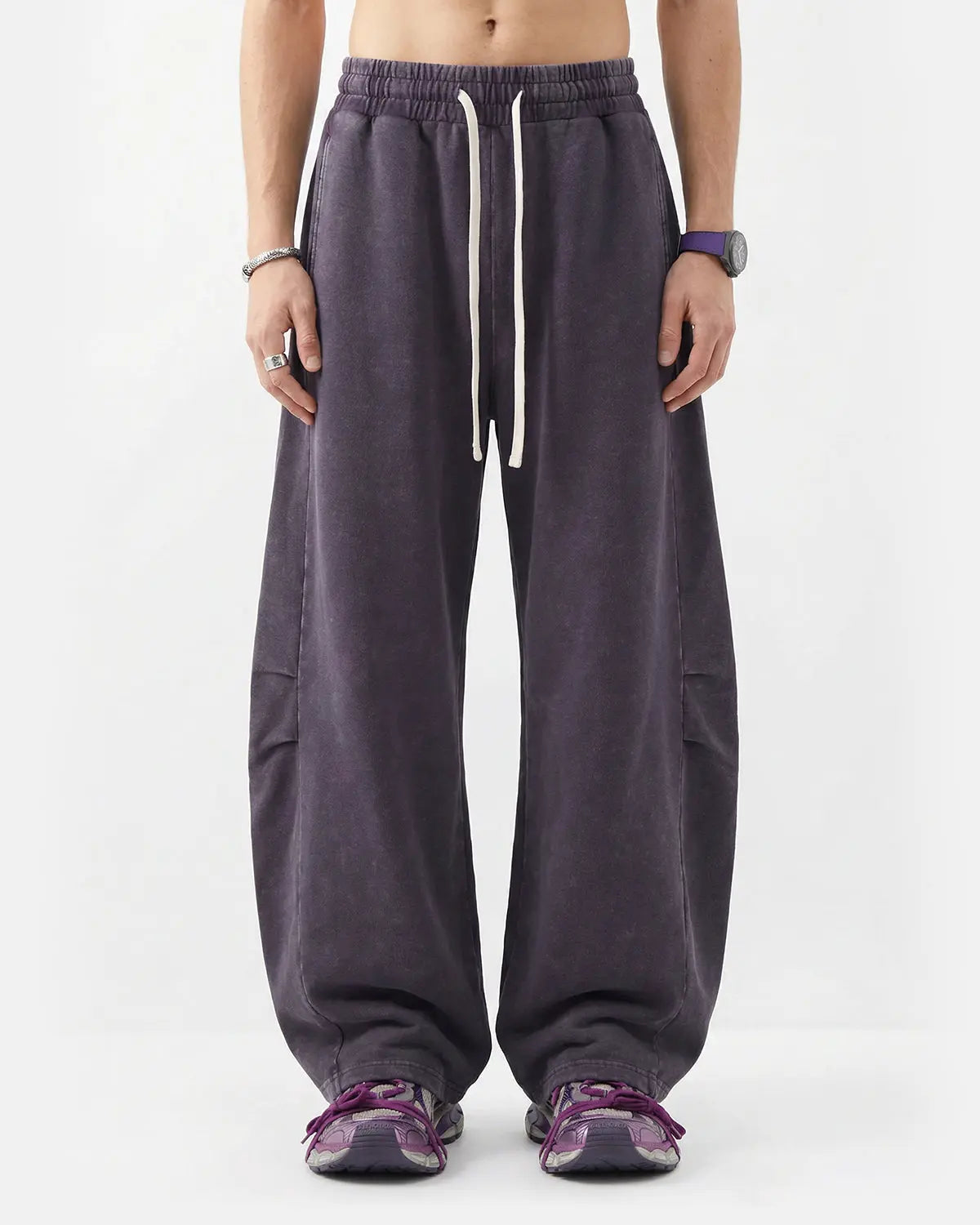 Distressed acid washed barrel sweatpants from Inflation Streetwear featuring a relaxed fit and worn-in style.
