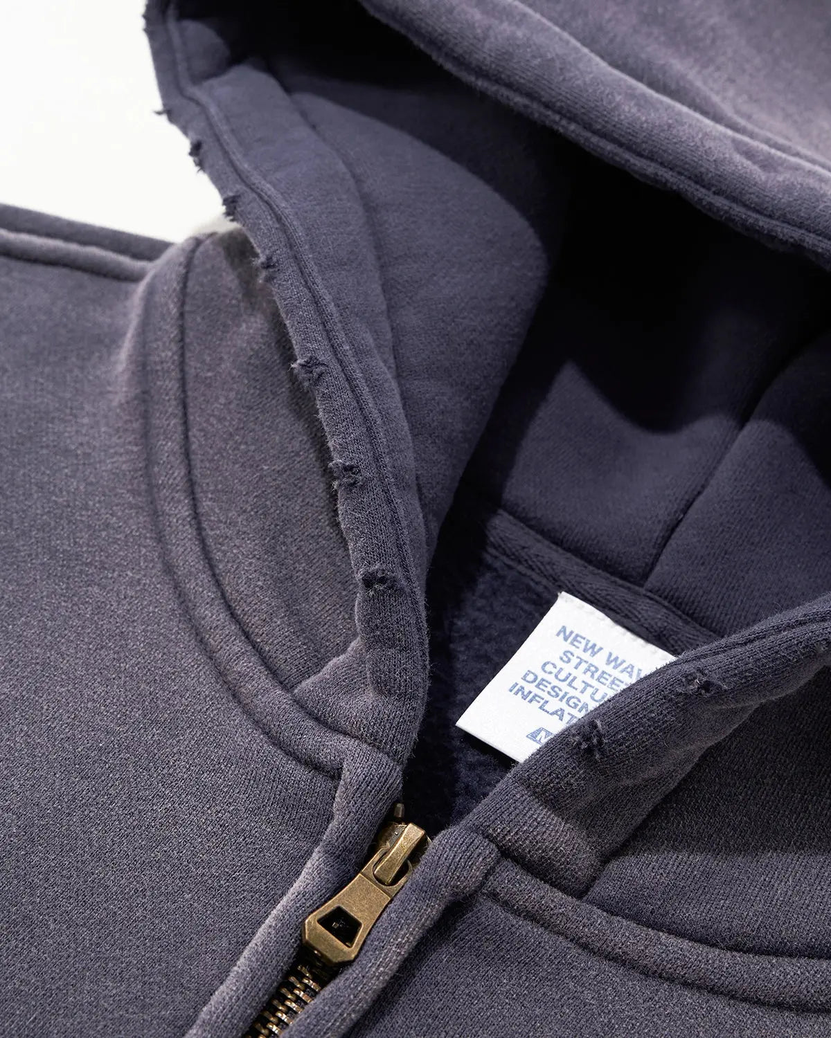 Inflation Streetwear Monkey Wash zip-up hoodie in black with front pockets and adjustable drawstrings, casual streetwear style.