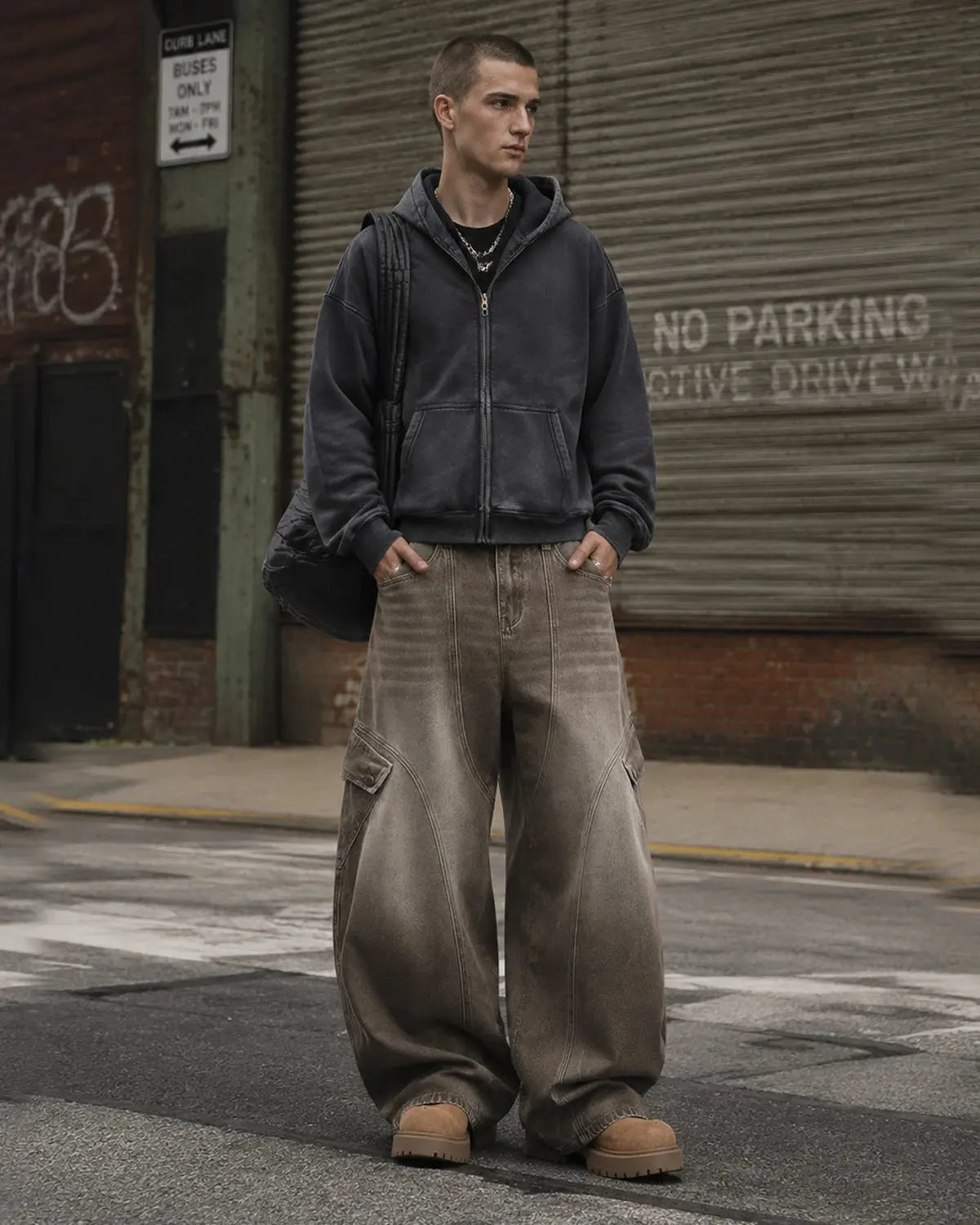 Brown acid wash barrel jeans by INFLATION featuring a relaxed fit, high waist, and vintage-inspired style.