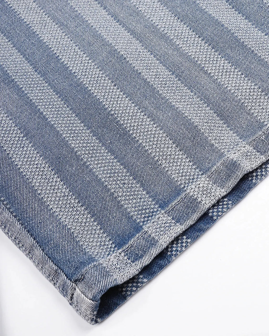 Woven texture baggy jorts by INFLATION featuring a relaxed fit and stylish streetwear design, shown in a casual outdoor setting.