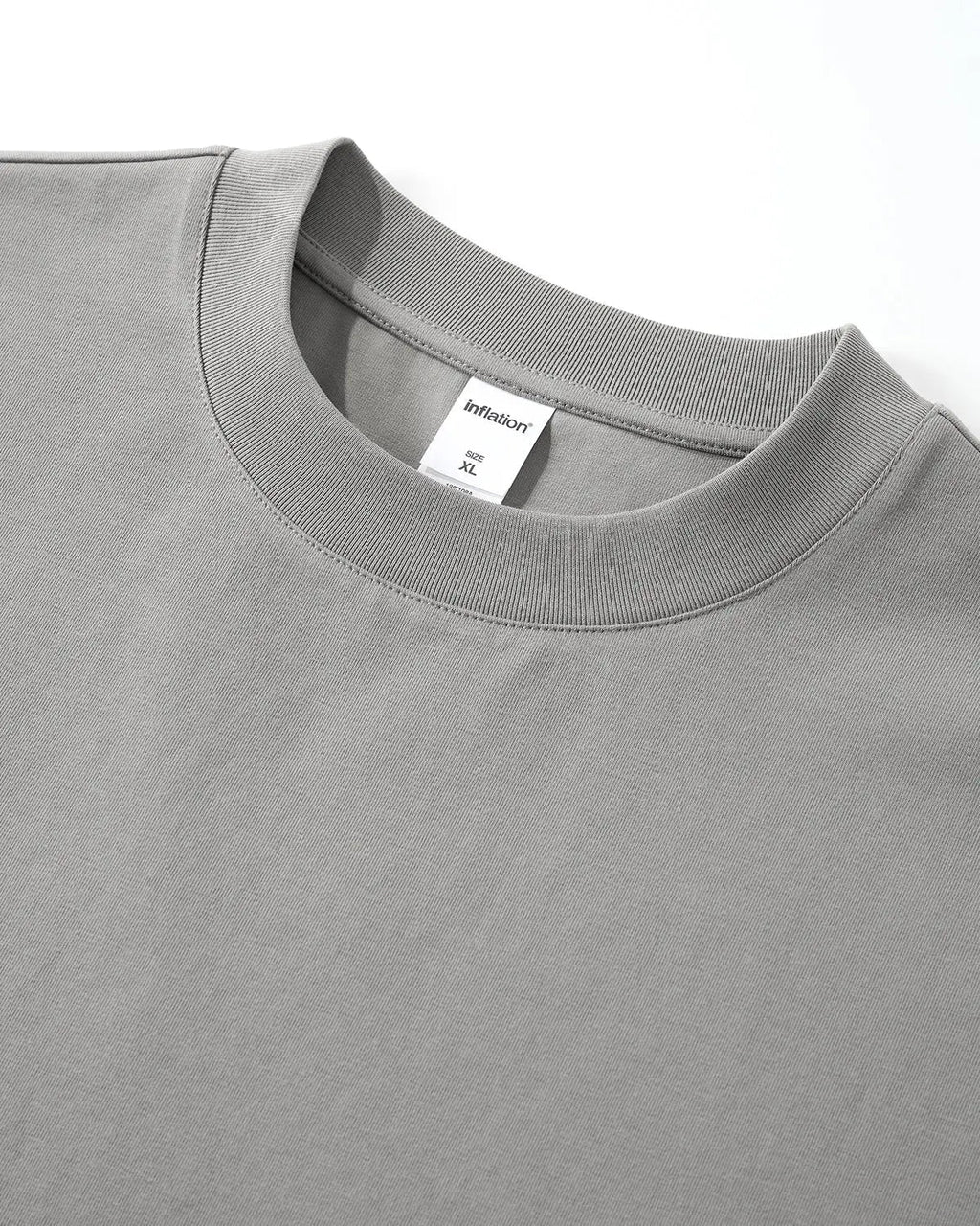 Inflation Streetwear embroidered frayed hem oversized T-shirt, casual fit with detailed embroidery and distressed hem, front view.