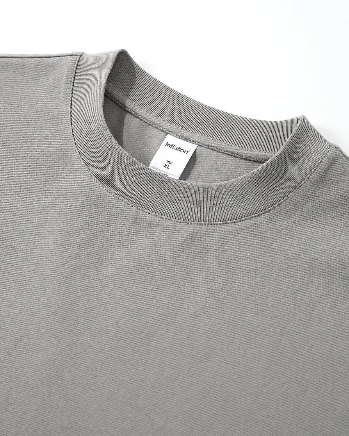 Inflation Streetwear embroidered frayed hem oversized T-shirt, casual fit with detailed embroidery and distressed hem, front view.