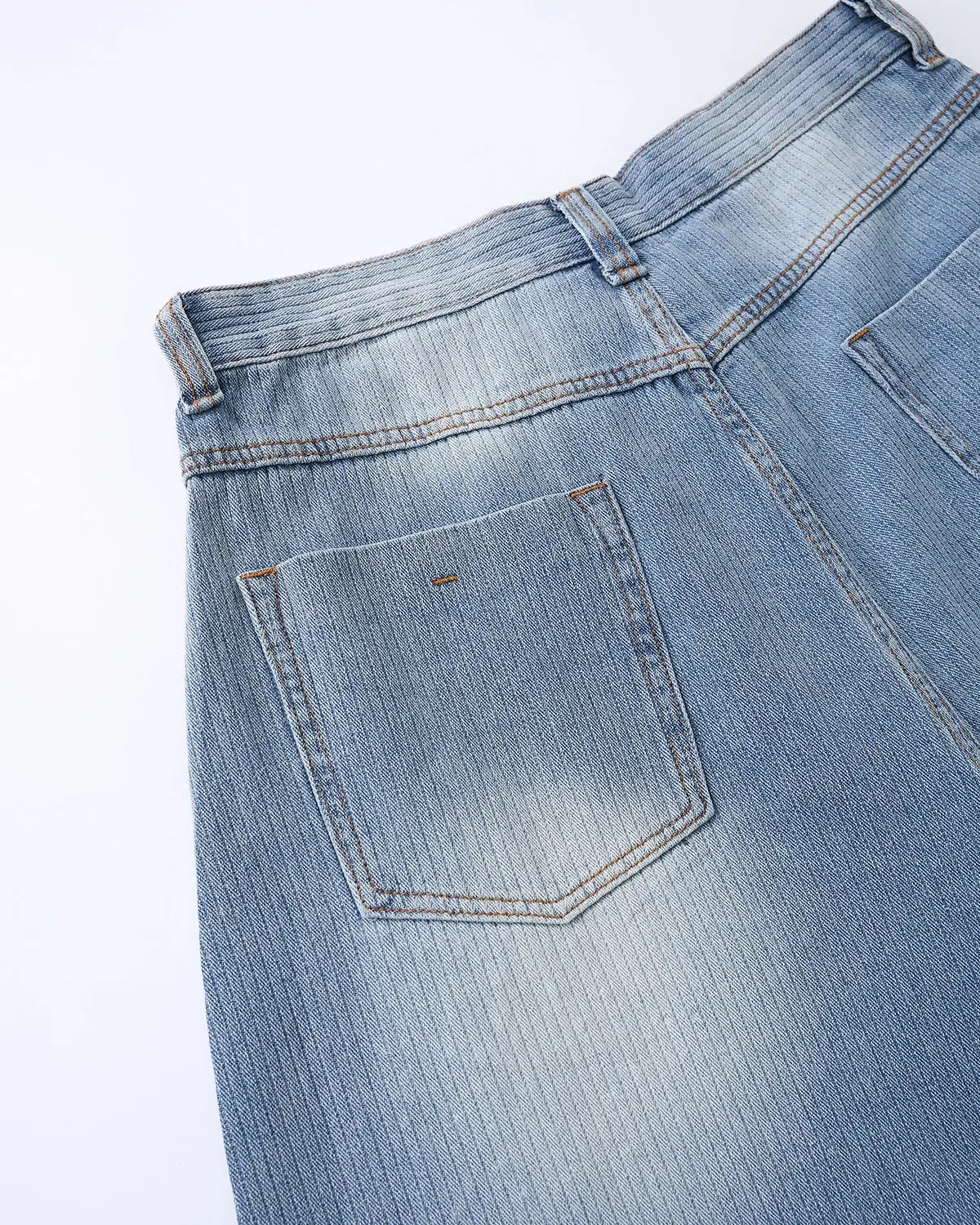 Star rhinestone longline denim shorts from INFLATION, stylish streetwear pants with sparkling star embellishments and distressed details.