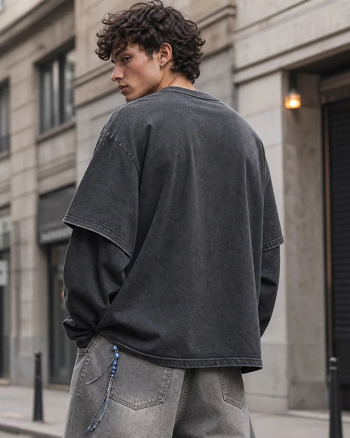Graphic distressed acid wash layered T-shirt by INFLATION, featuring a faded, textured design with multiple fabric layers.
