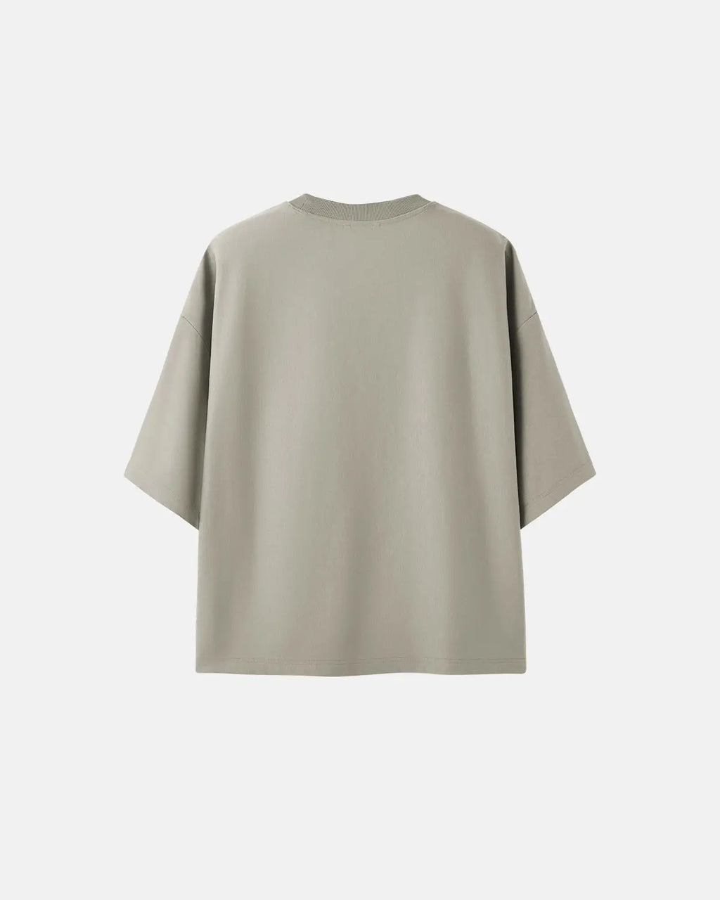 Oversized blank boxy T-shirt by INFLATION, streetwear style, with a loose fit and simple design, displayed on a hanger.