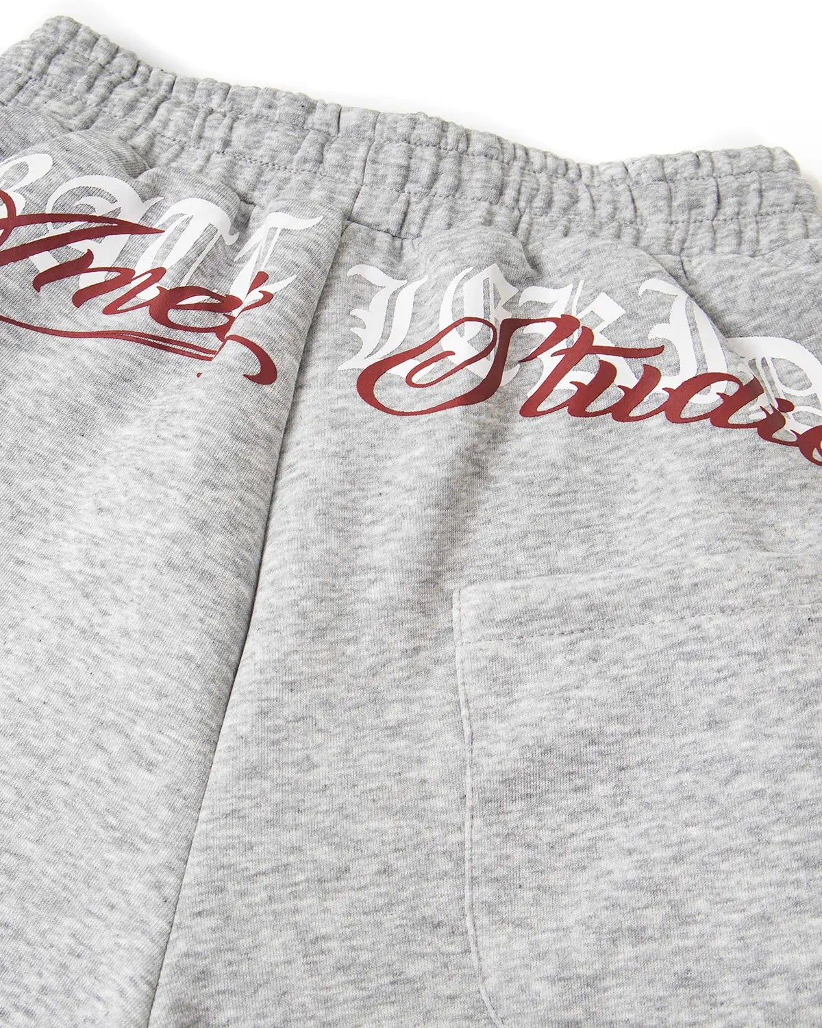 Inflation Cross Print Baggy Sweatpants in black with bold cross graphics, relaxed fit streetwear style.