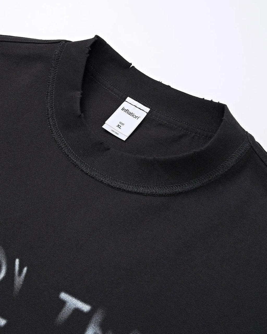 Vintage sticker graphic oversized T-shirt by INFLATION featuring bold, colorful retro-inspired streetwear design and relaxed fit.