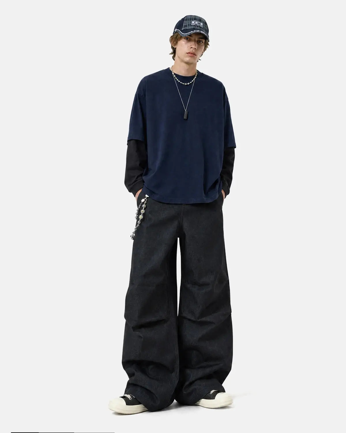 Inflation Super Raw Baggy Jeans featuring a loose fit, distressed denim, and streetwear style in a casual, relaxed design.