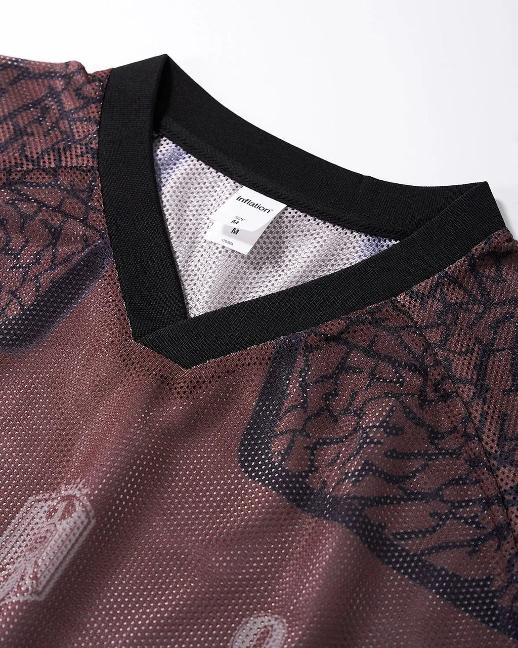 Inflation Streetwear tribal pattern mesh jersey t-shirt with bold tribal design and lightweight breathable fabric.