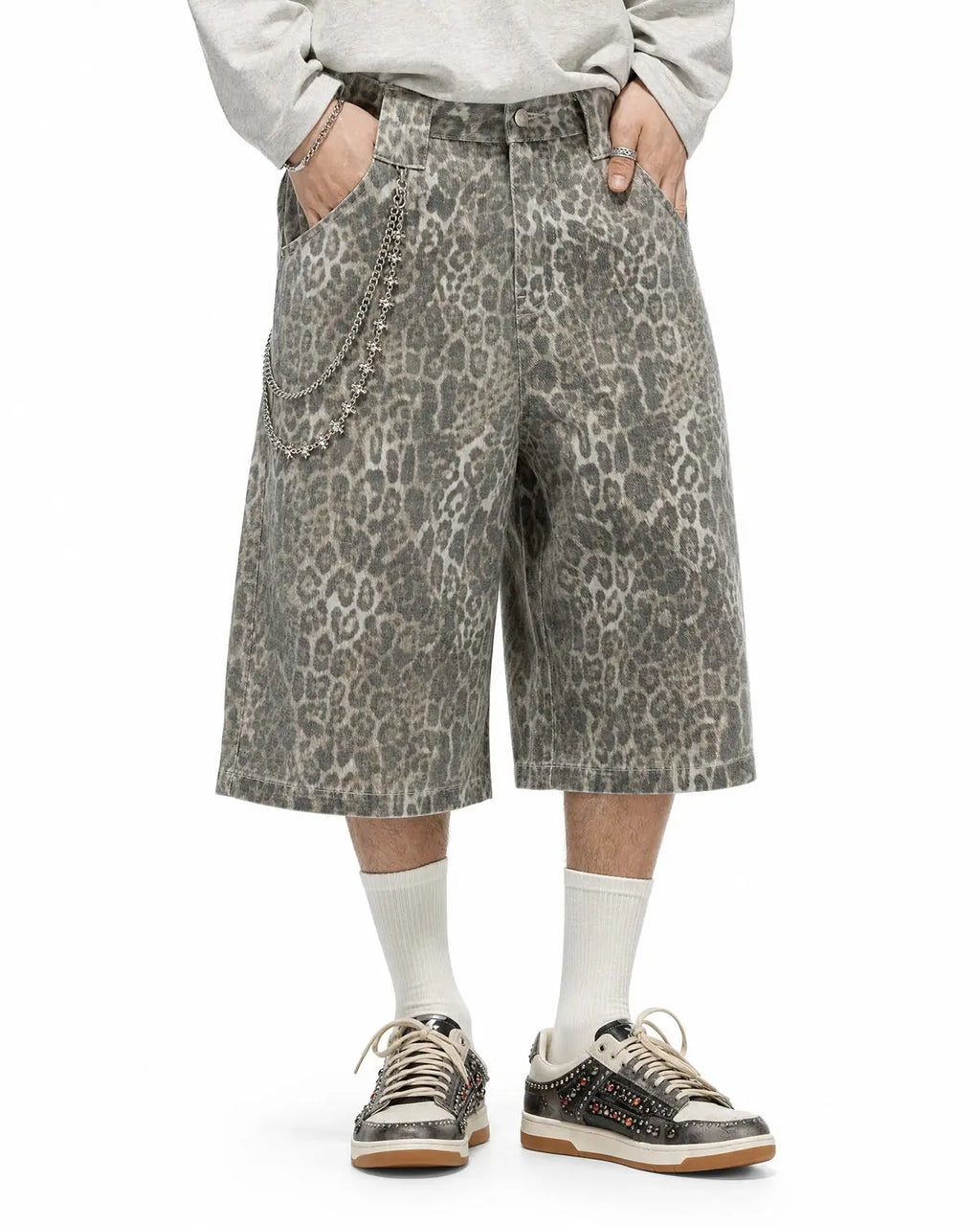 Leopard print baggy shorts by INFLATION, stylish streetwear pants with a relaxed fit and bold animal pattern.