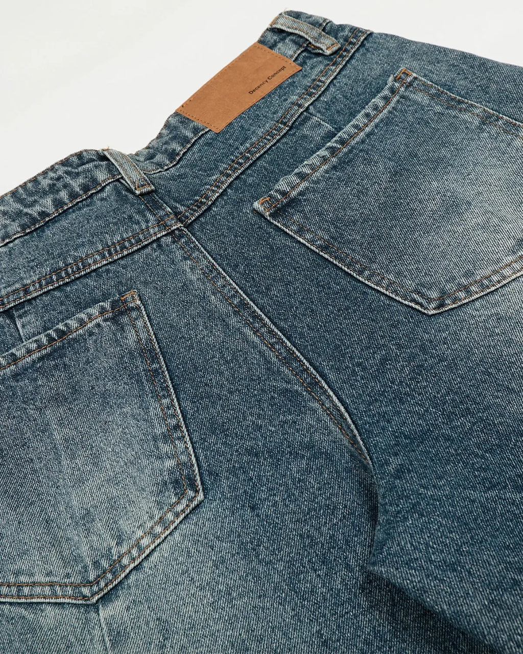Inflation Whisker Acid Washed Barrel Jeans with distressed details, showcasing a relaxed fit and trendy streetwear style.