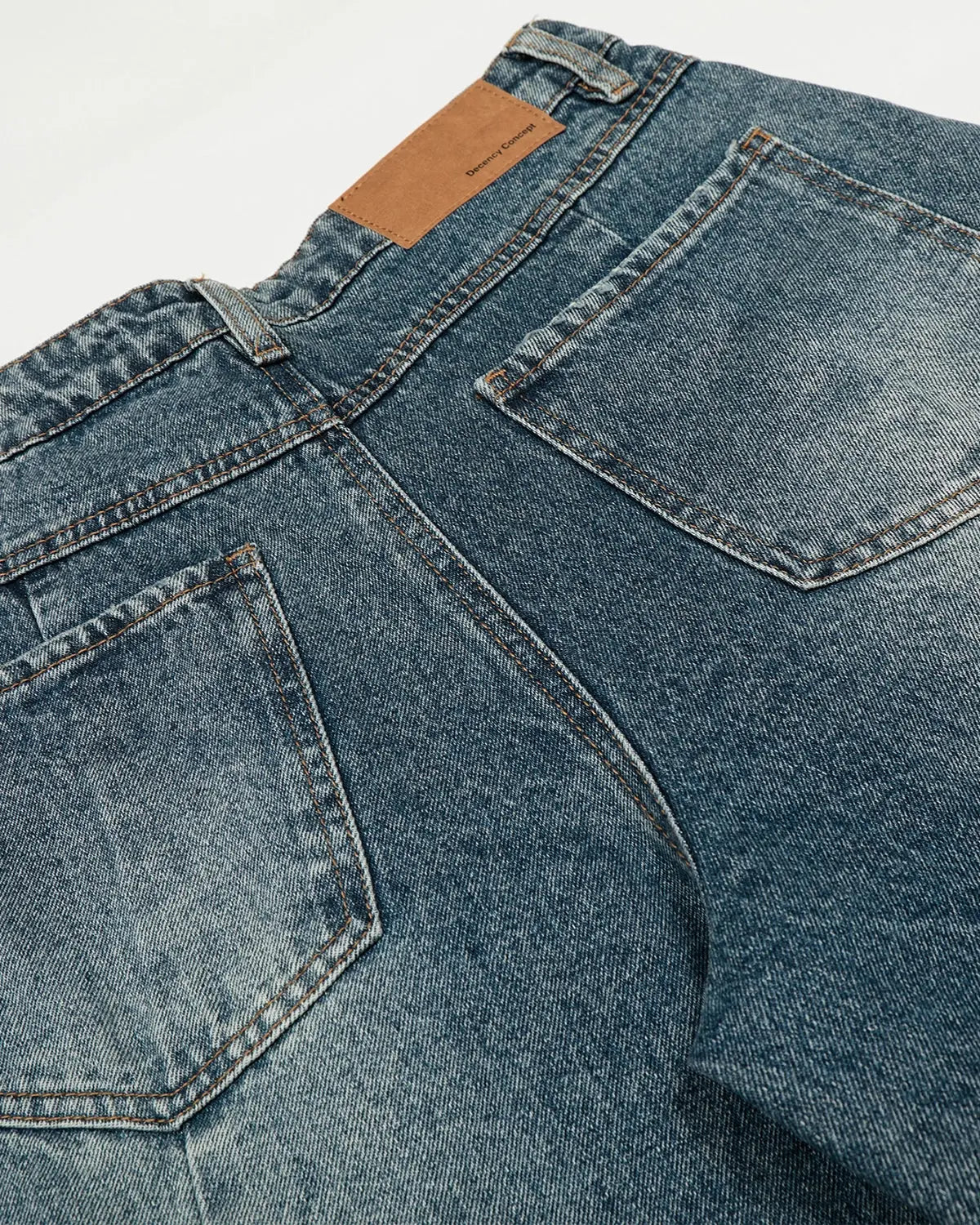 Inflation Whisker Acid Washed Barrel Jeans with distressed details, showcasing a relaxed fit and trendy streetwear style.