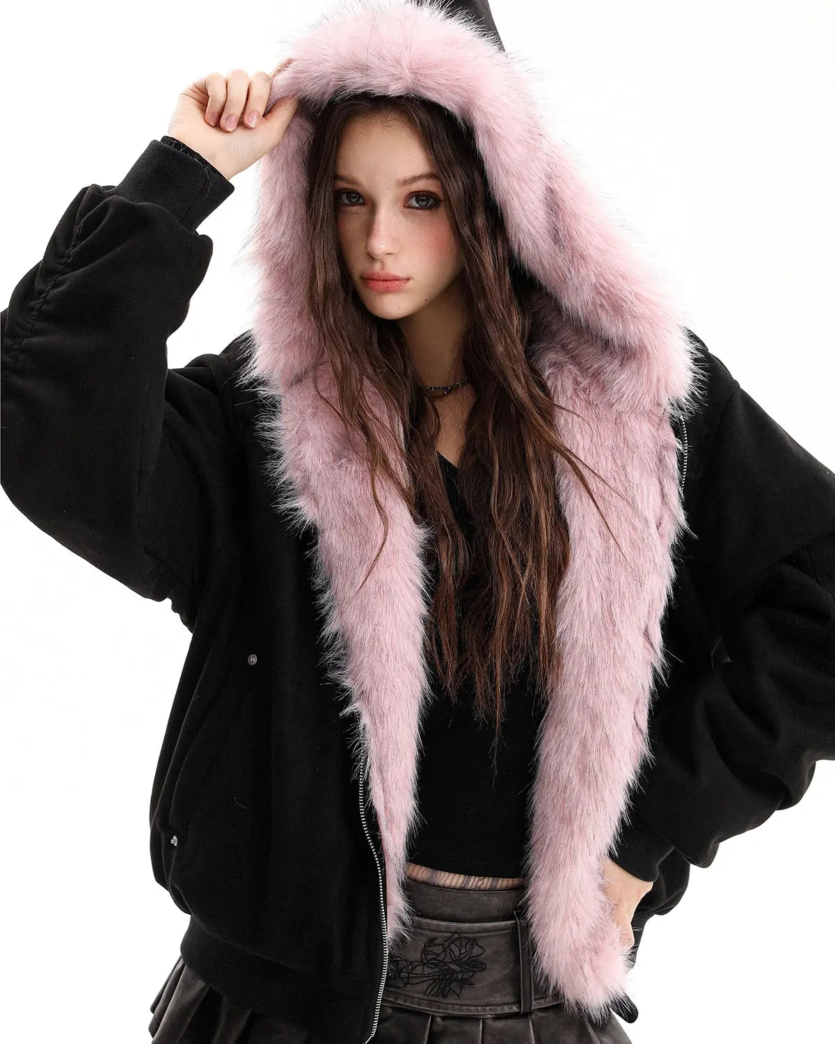 Reversible faux fur hooded jacket by INFLATION, featuring plush fur exterior and sleek streetwear style, shown in a close-up view.