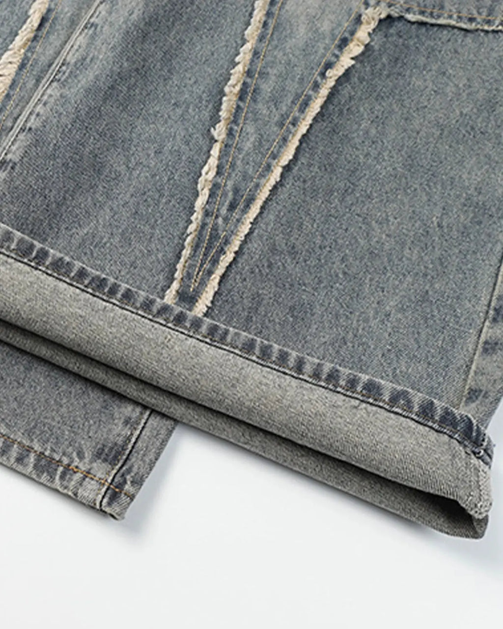 Star patched baggy jeans by INFLATION featuring distressed details and a relaxed fit, styled with a casual streetwear look.