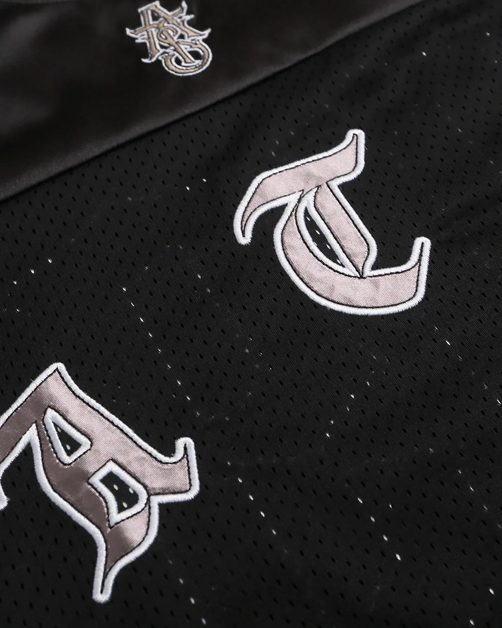 Gothic embroidered mesh jersey t-shirt by INFLATION with dark, intricate embroidery on lightweight, see-through mesh fabric.