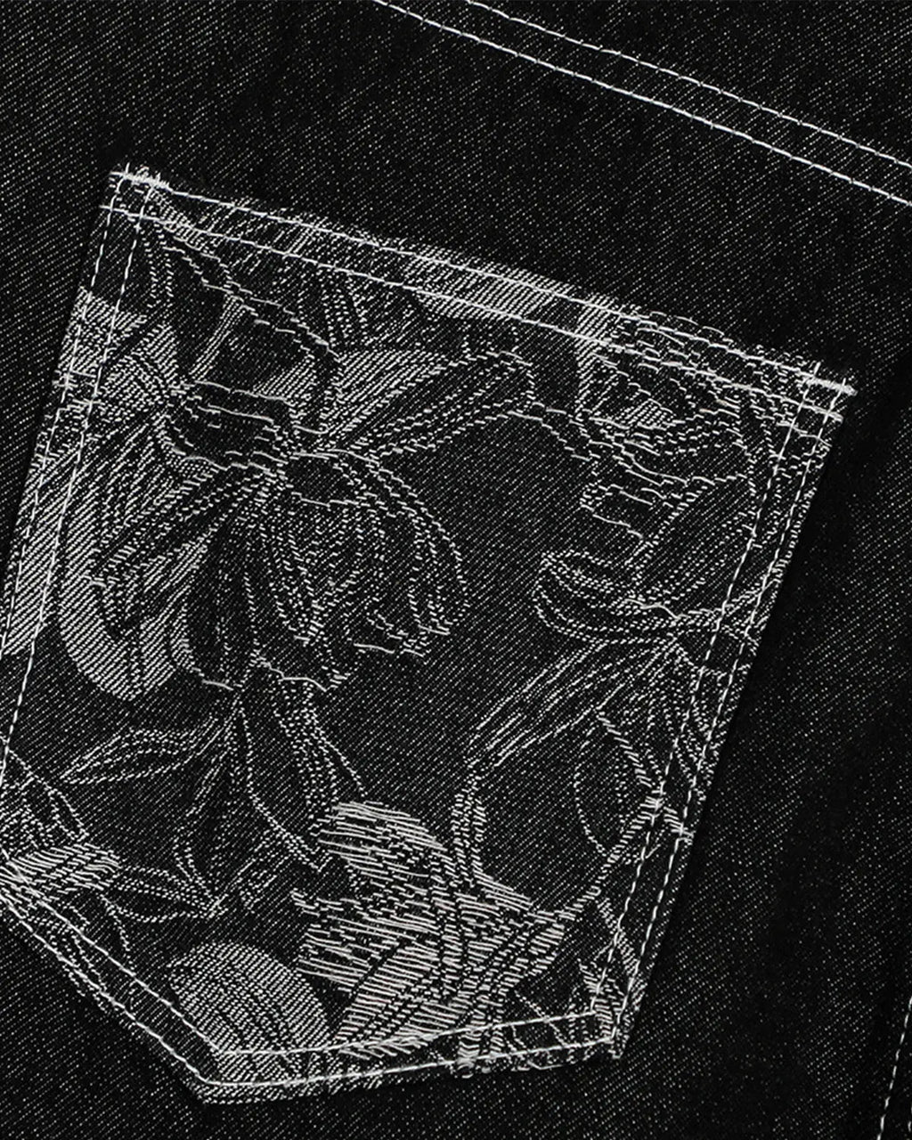 Inflation brand baggy denim jorts with embroidered pocket, showcasing loose fit and stylish detail on a pair of casual pants.