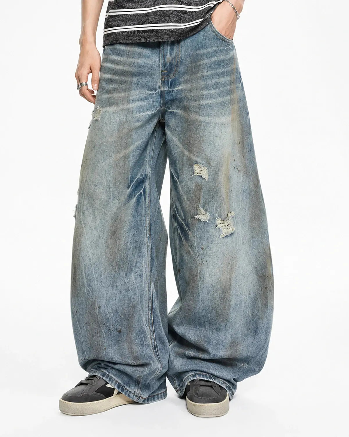 Inflation Dirty Wash Distressed Barrel Jeans featuring ripped details and vintage-style denim for streetwear fashion.