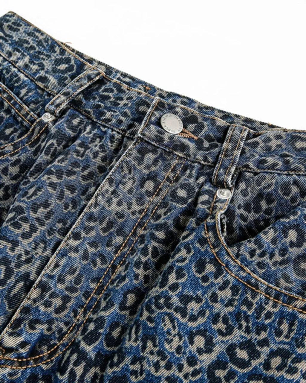Vintage leopard print barrel jeans by INFLATION featuring bold animal print and relaxed fit, styled with casual streetwear look.