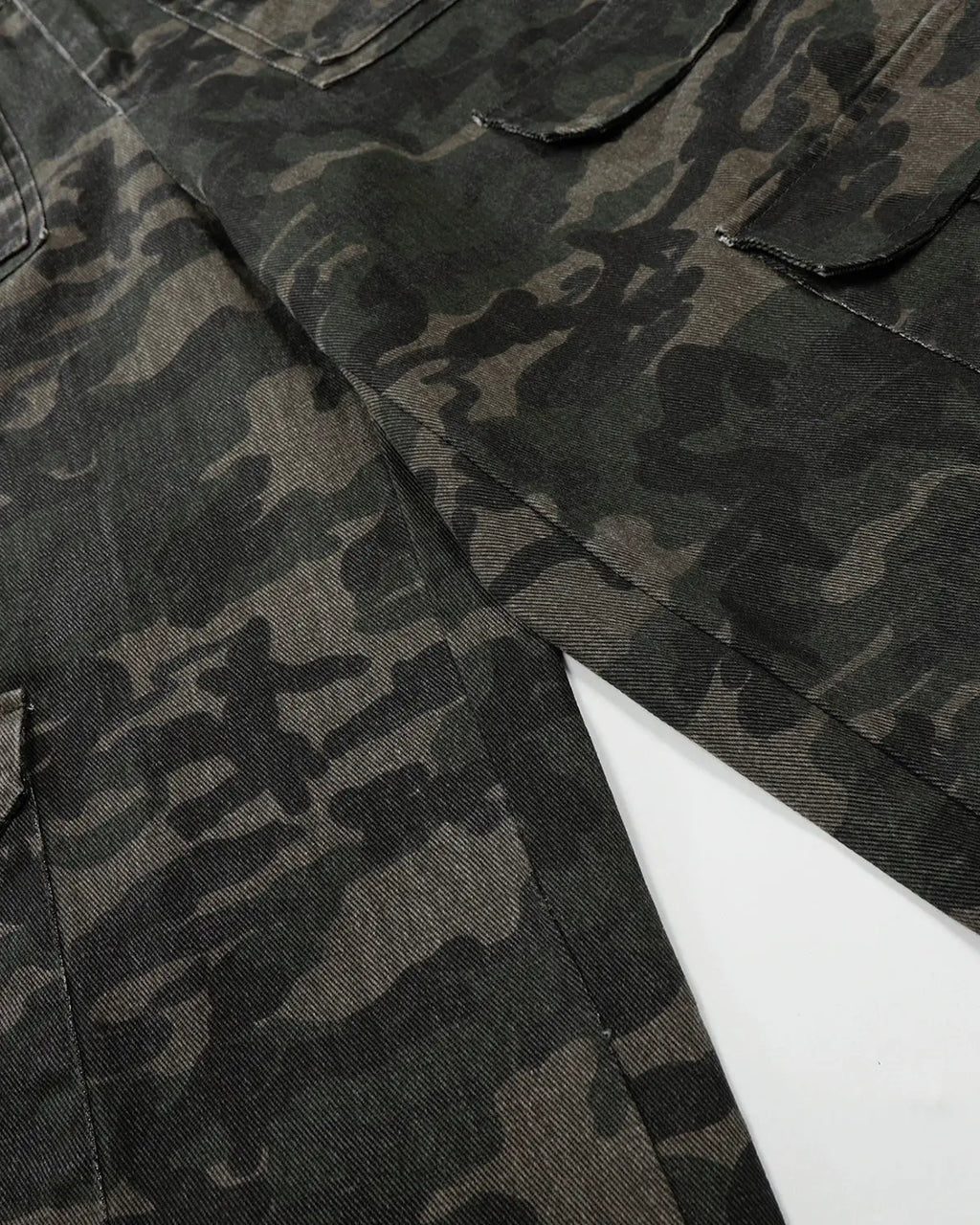 Inflation streetwear camouflage cargo pants with multiple pockets, relaxed fit, and rugged design for casual urban style.