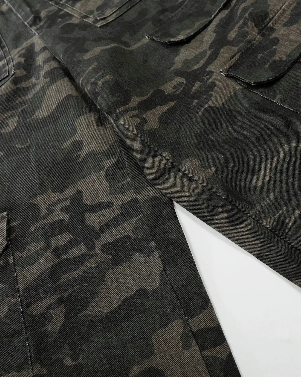 Inflation streetwear camouflage cargo pants with multiple pockets, relaxed fit, and rugged design for casual urban style.