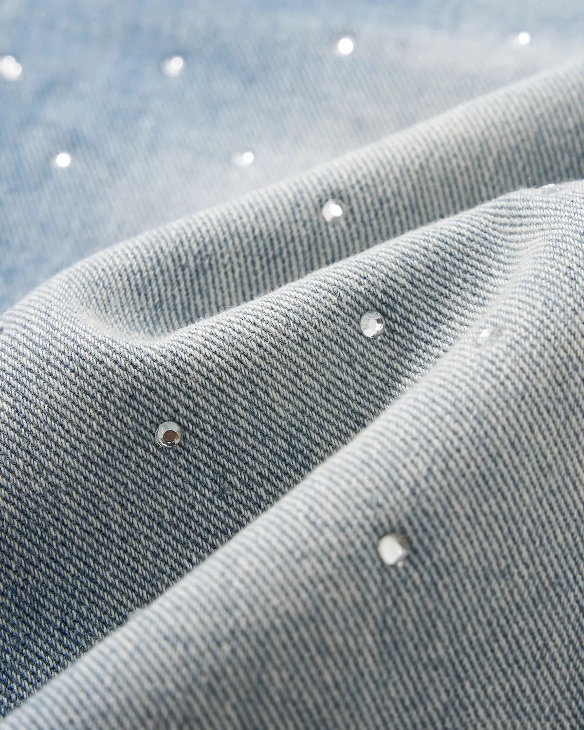 Blue rhinestone baggy jeans shorts by INFLATION, featuring distressed denim and rhinestone embellishments, casual streetwear style.