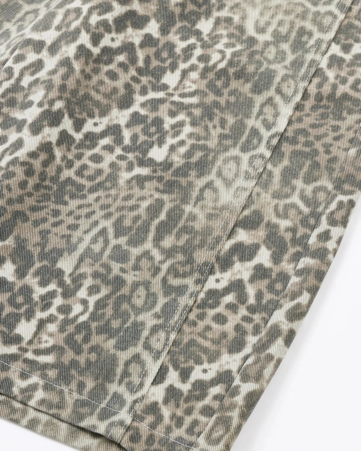 Leopard print baggy shorts by INFLATION, stylish streetwear pants with a loose fit and bold animal pattern.