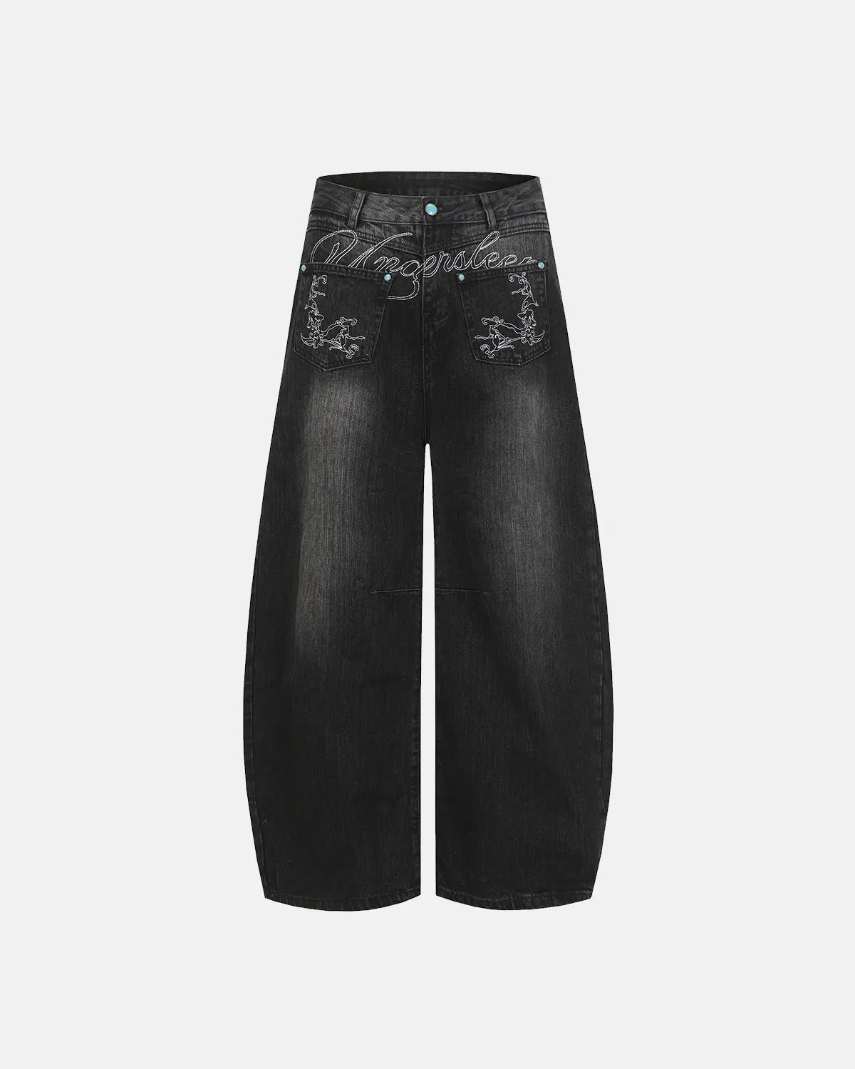 Graphic embroidered washed barrel jeans by INFLATION, showing details of the distressed denim and colorful embroidery on the pants.