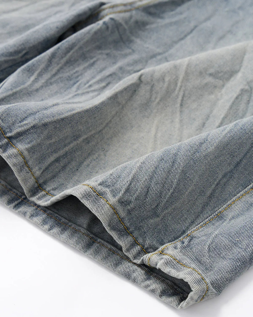 Textured washed longline jorts by INFLATION, casual denim pants with distressed detailing and a relaxed fit.