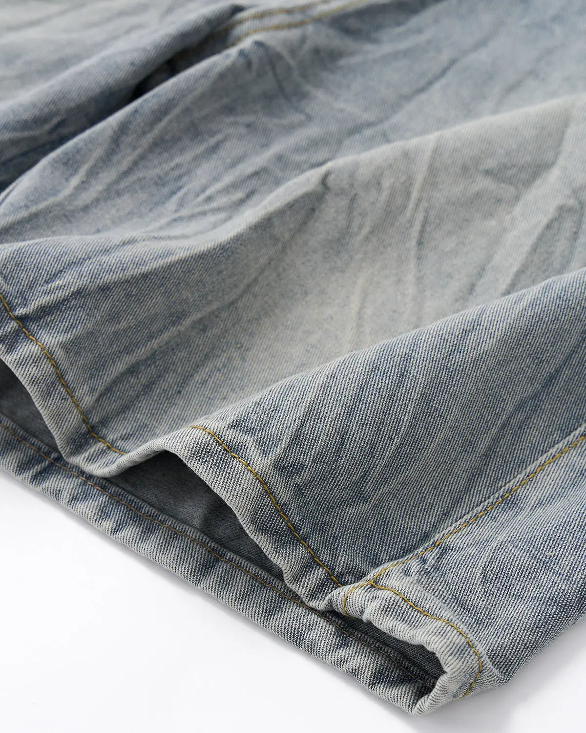 Textured washed longline jorts by INFLATION, casual denim pants with distressed detailing and a relaxed fit.