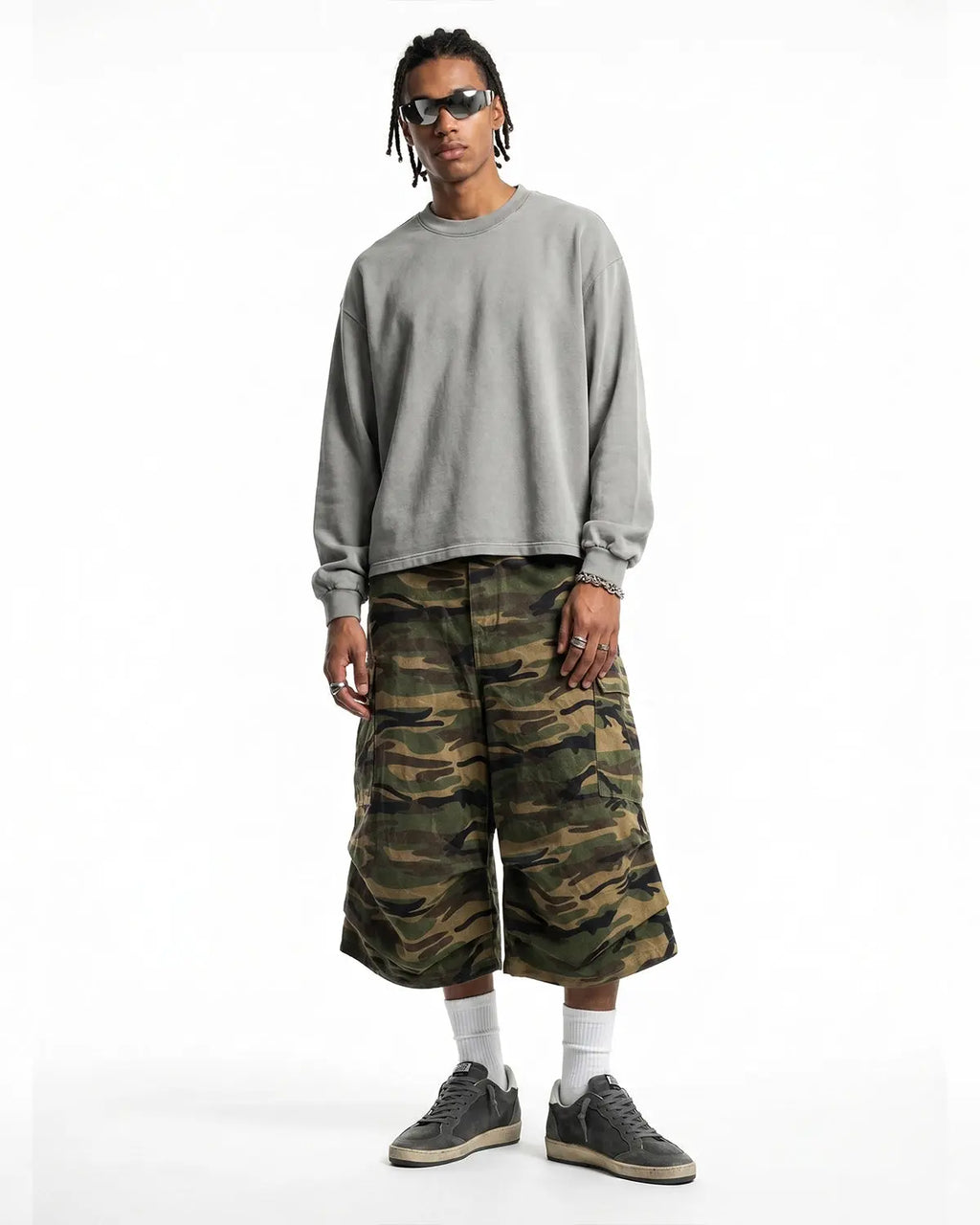 Distressed washed long sleeve tee by INFLATION featuring a vintage, worn-in look with frayed edges and casual streetwear style.