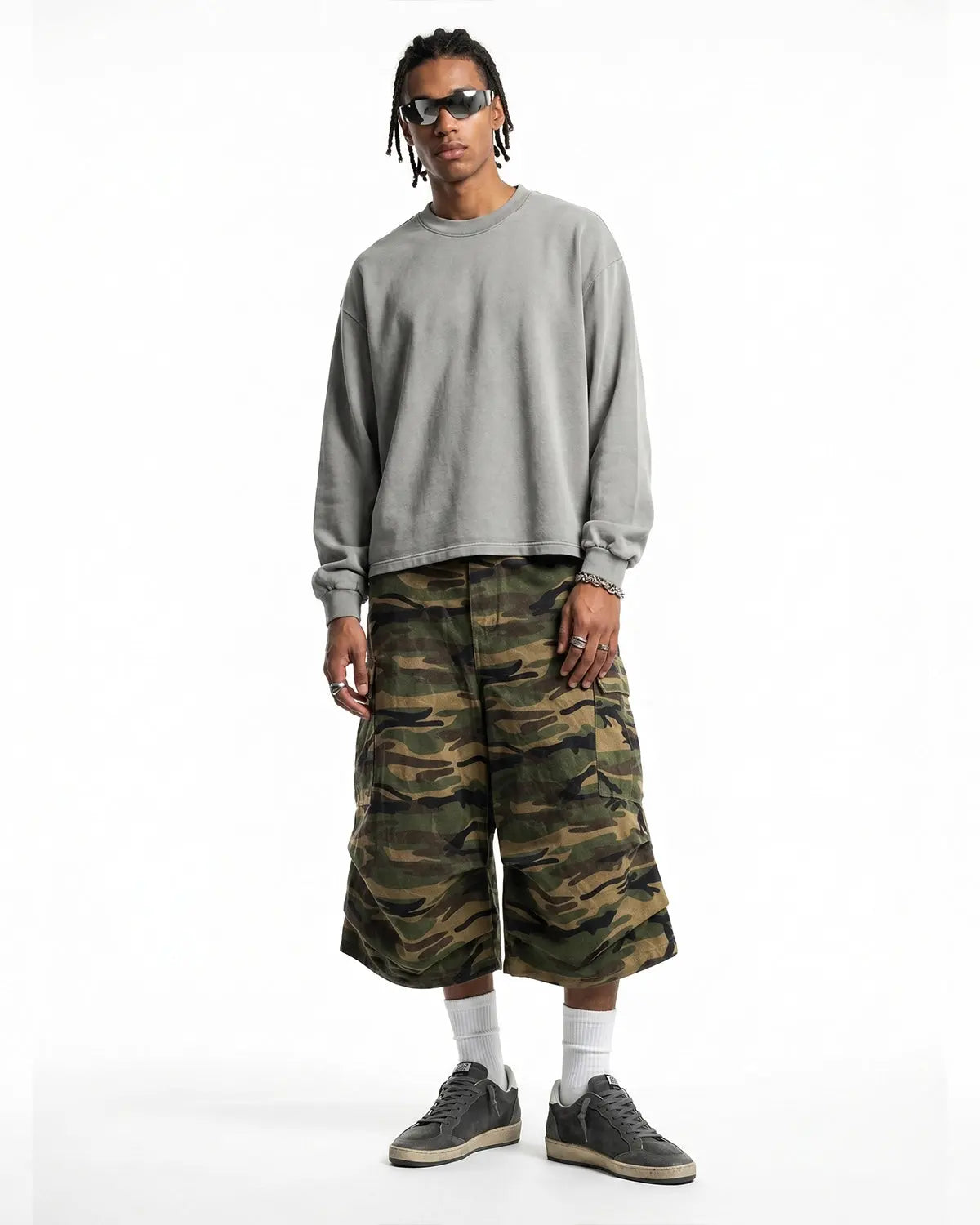 Distressed washed long sleeve tee by INFLATION featuring a vintage, worn-in look with frayed edges and casual streetwear style.