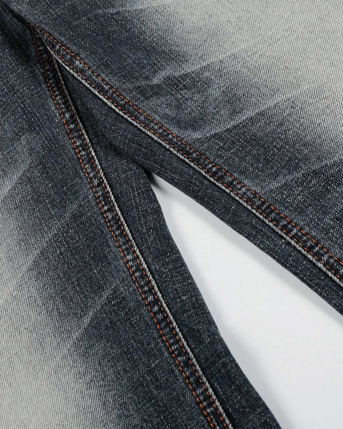 Faded Whisker Baggy Jeans by INFLATION featuring distressed denim, relaxed fit, and faded details, streetwear style.