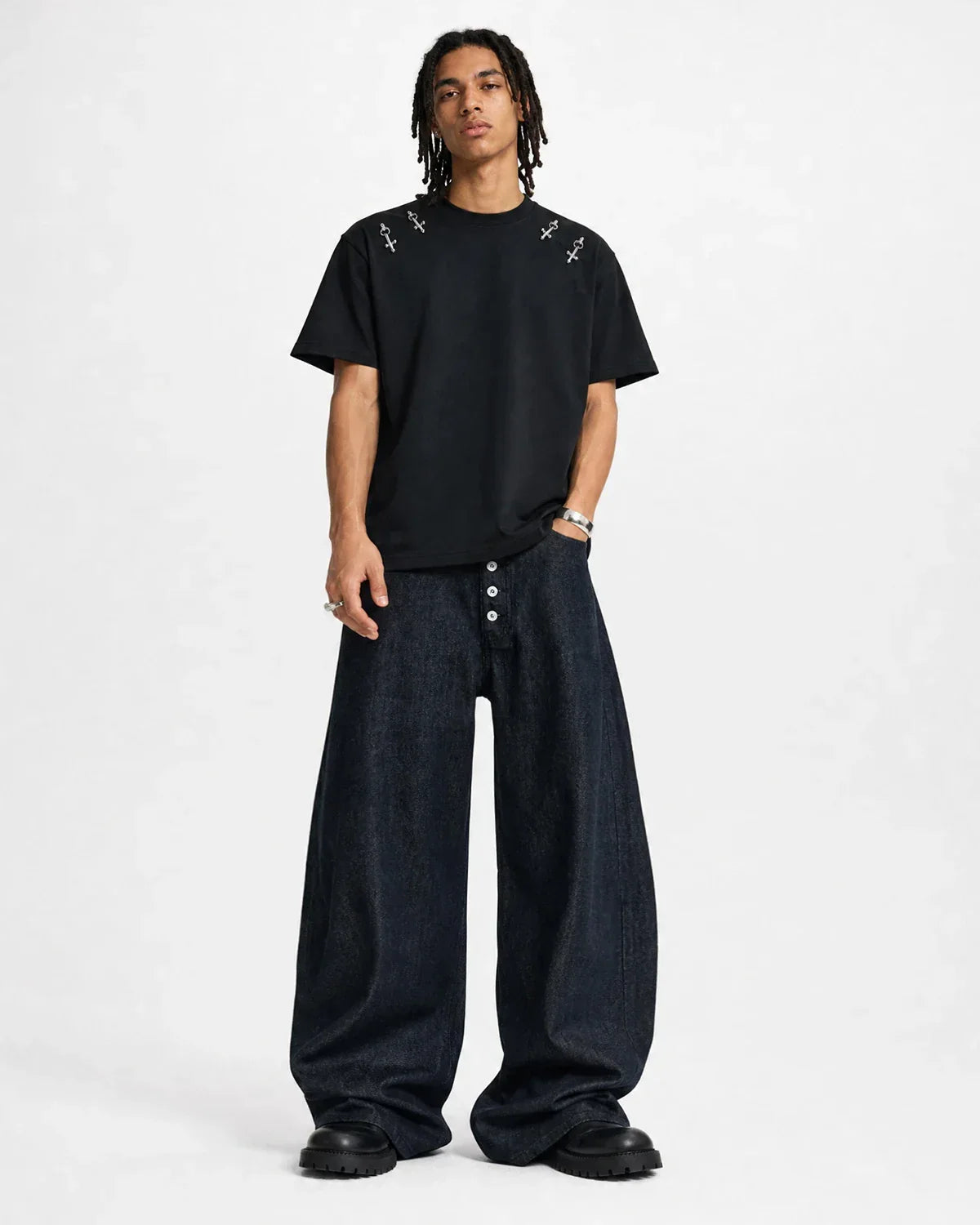 Inflation Streetwear Button-Up Raw Baggy Jeans featuring a relaxed fit and raw hem, displayed on a hanger.