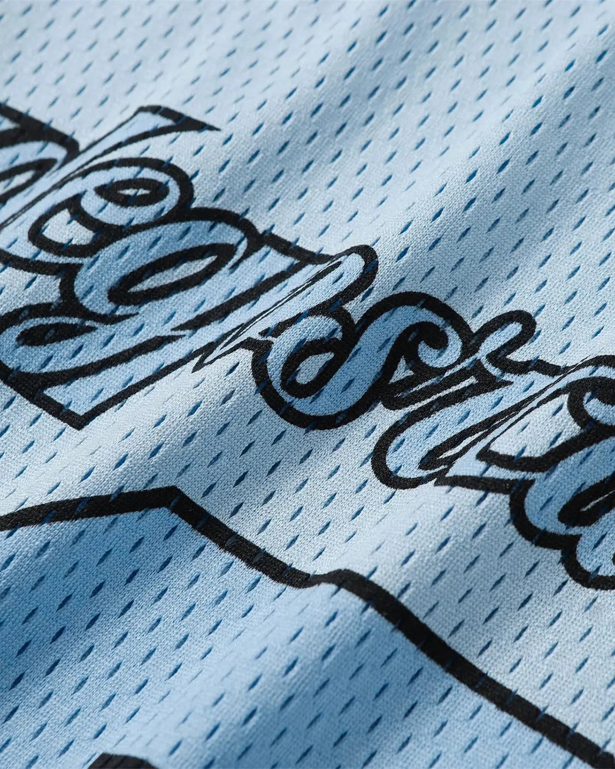 Oversized mesh patchwork jersey by INFLATION, featuring a colorful, breathable streetwear design with mixed fabric panels.