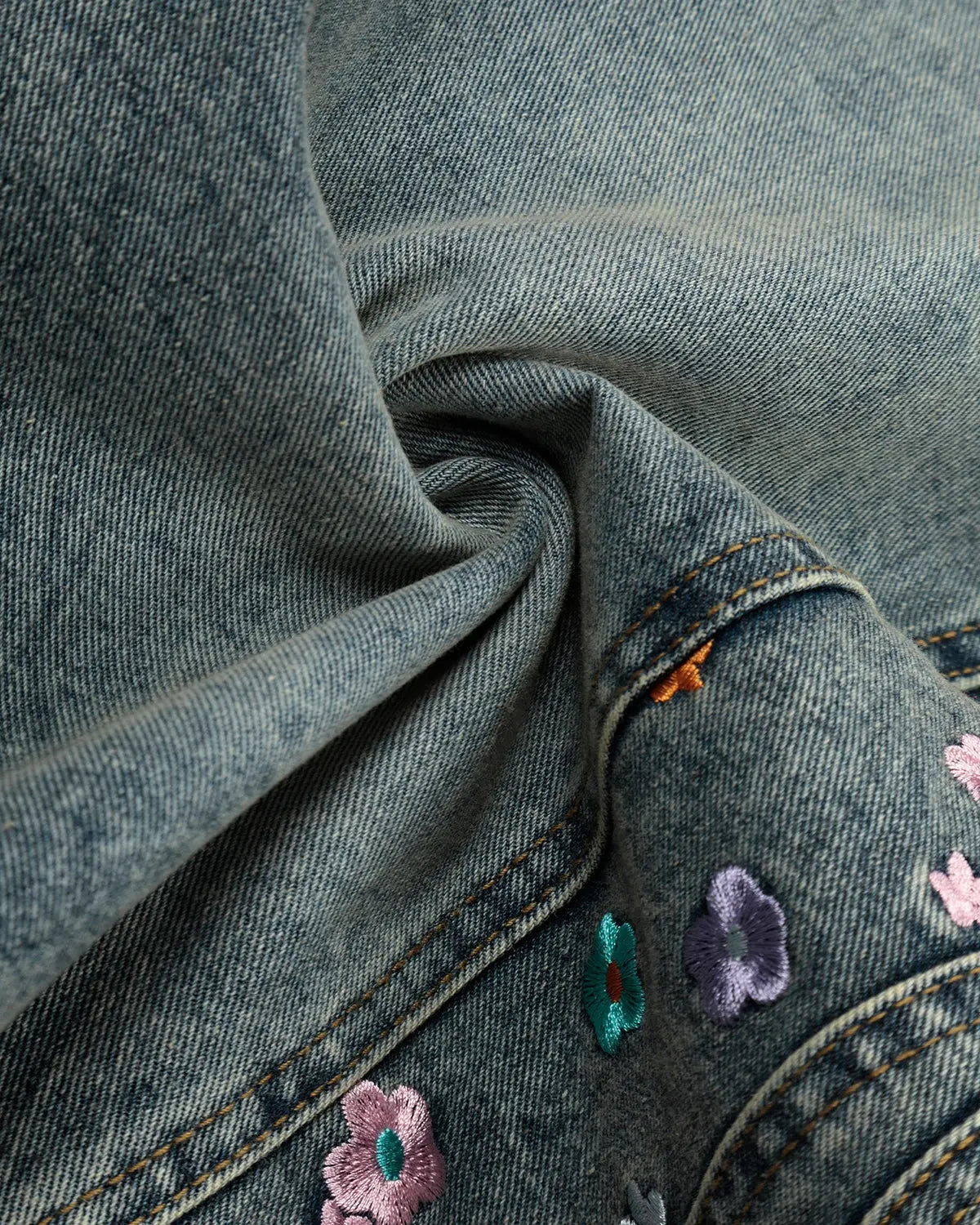 Inflation brand floral embroidered long baggy jorts pants with colorful floral embroidery and relaxed fit style.