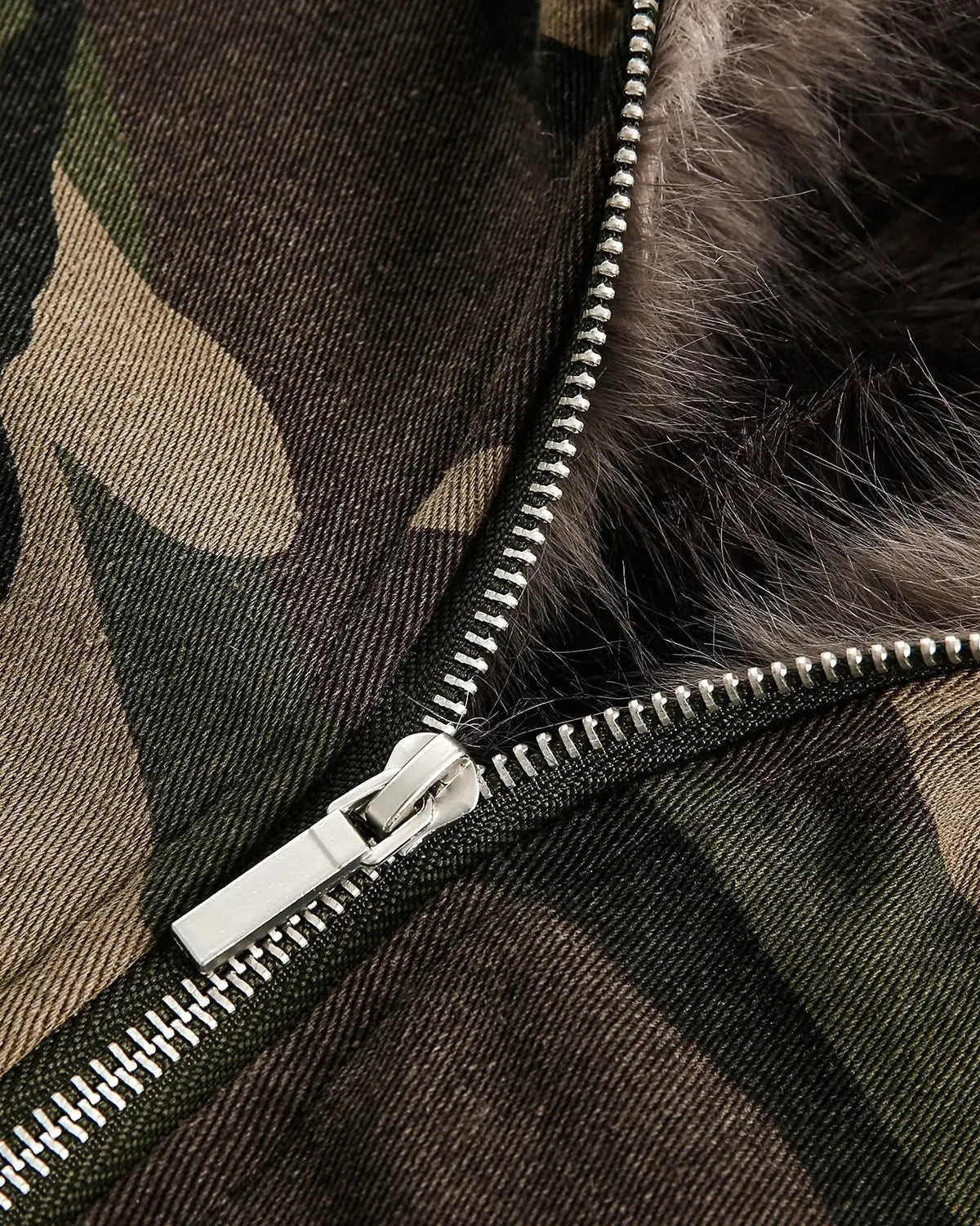 Inflation Camo Faux Fur Lined Bomber Jacket displayed on a hanger, featuring camouflage fabric and plush fur lining for streetwear style.