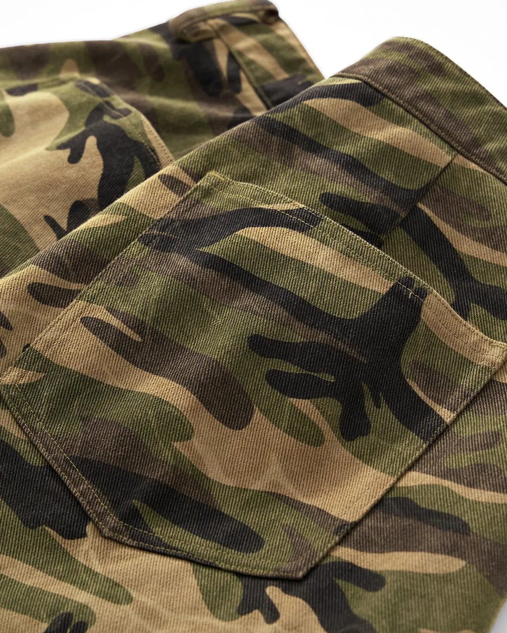 Inflation Streetwear camo cargo baggy shorts with multiple pockets and relaxed fit, featuring a green camouflage pattern.