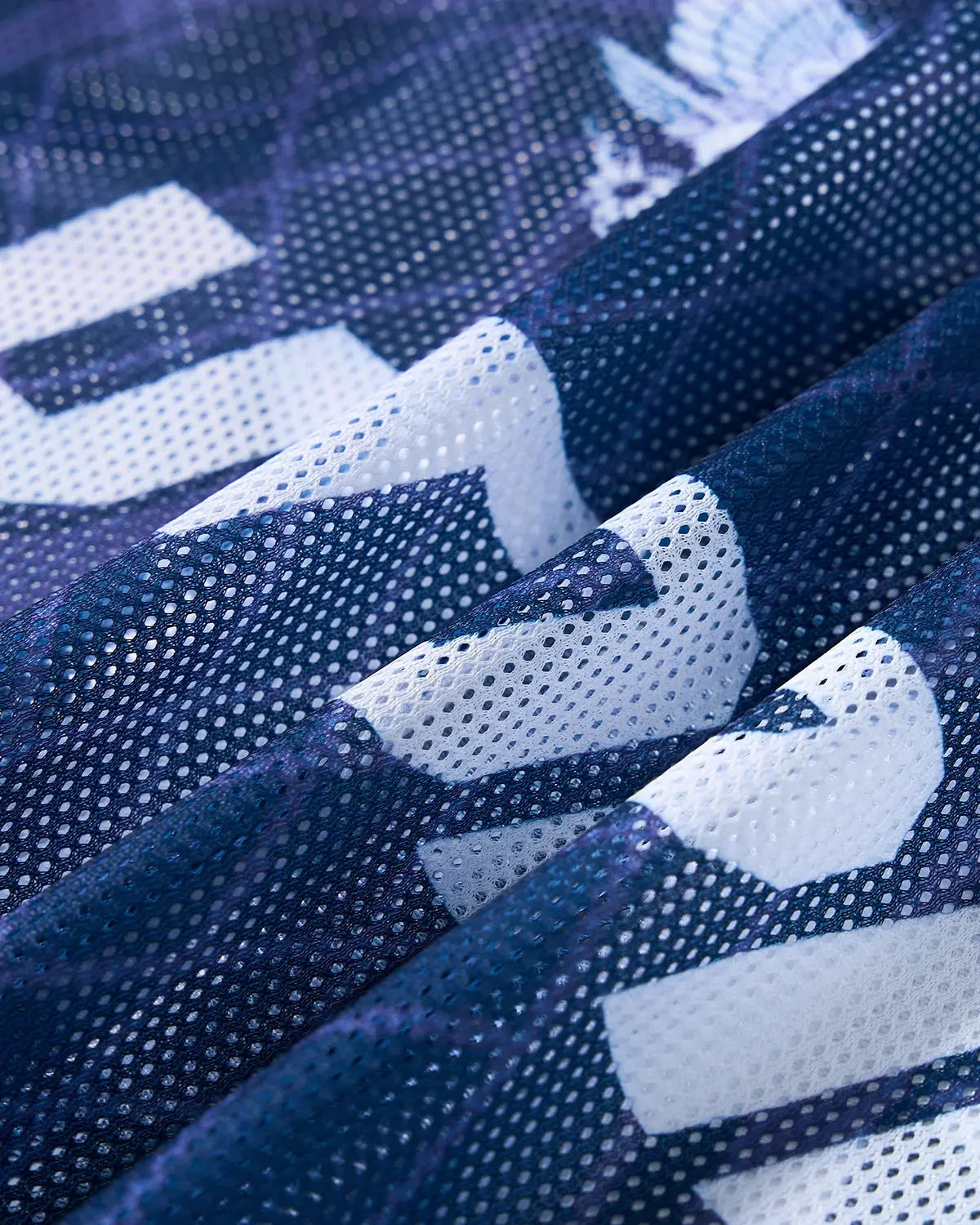 Inflation Streetwear geometric pattern mesh jersey t-shirt featuring a modern, colorful design on lightweight fabric.