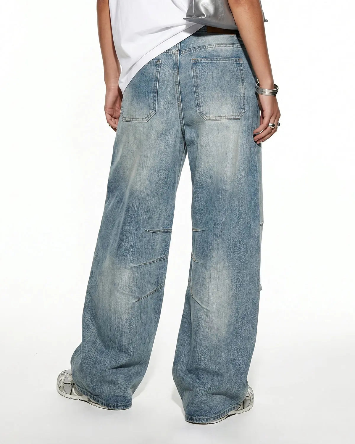 Deconstructed bamboo weave baggy jeans by INFLATION Streetwear featuring relaxed fit and textured fabric detail.