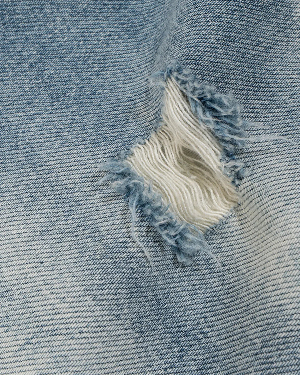 Inflation Streetwear frayed longline baggy jorts, denim pants with distressed edges and oversized fit, casual streetwear style.
