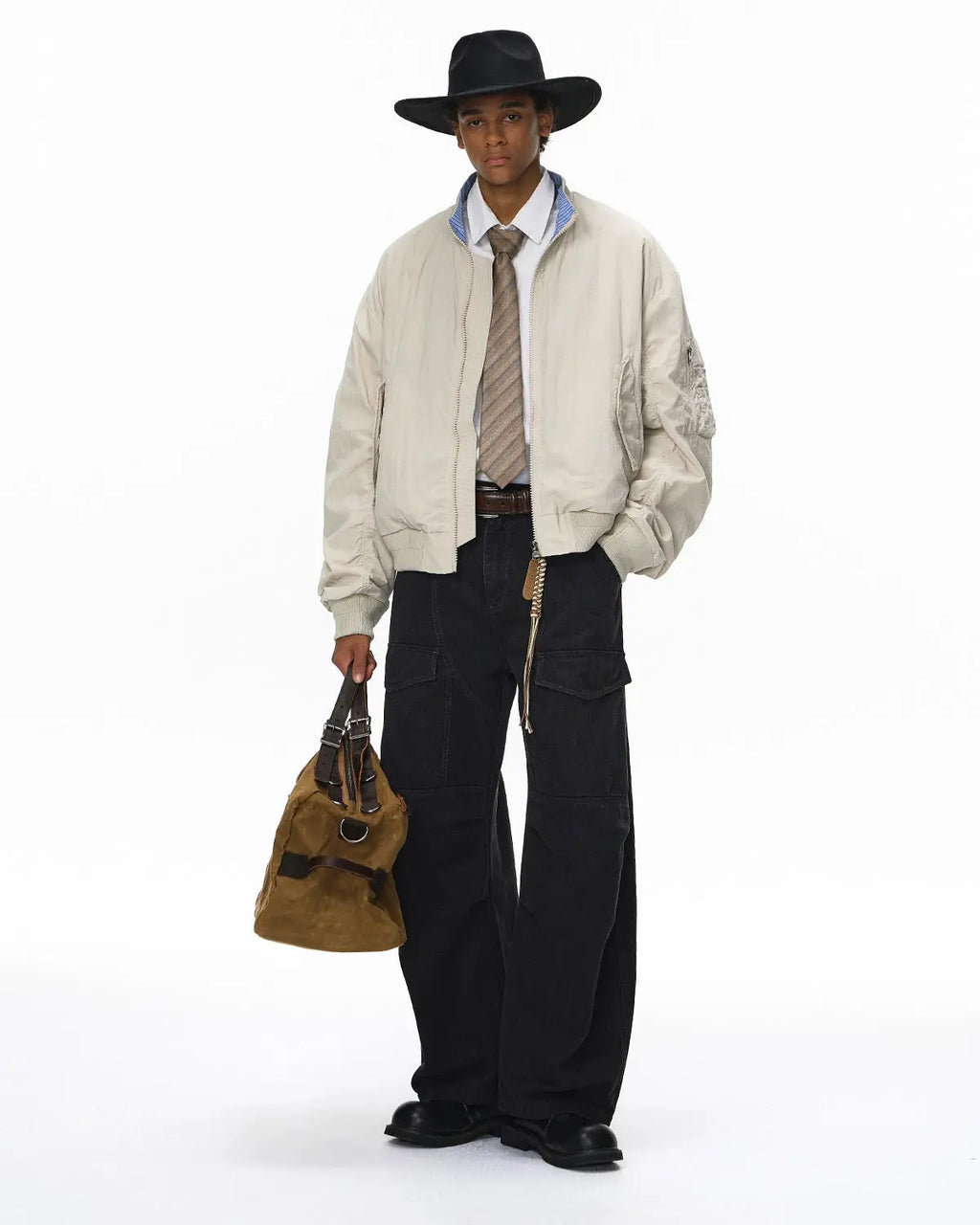 Inflation streetwear cargo pants with multiple pockets, garment washed for a vintage look, casual streetwear style, front view.