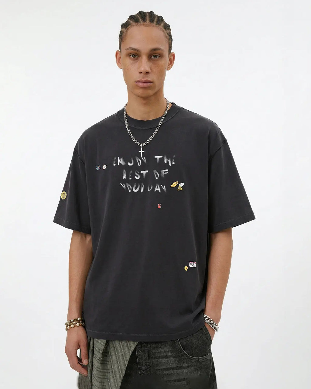 Vintage sticker graphic oversized T-shirt by INFLATION featuring bold streetwear design with colorful sticker prints.