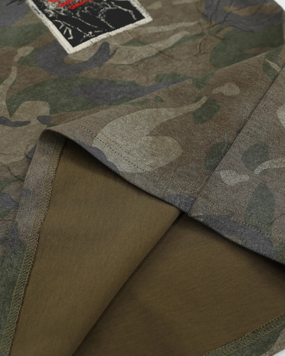 Vintage camouflage graphic T-shirt by INFLATION featuring a bold patch design and streetwear style.