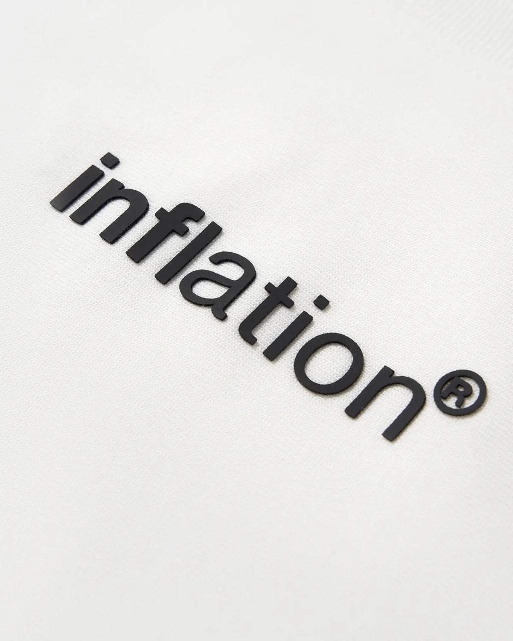 White cotton T-shirt with inflation logo print, casual streetwear tee, soft fabric, and classic fit.
